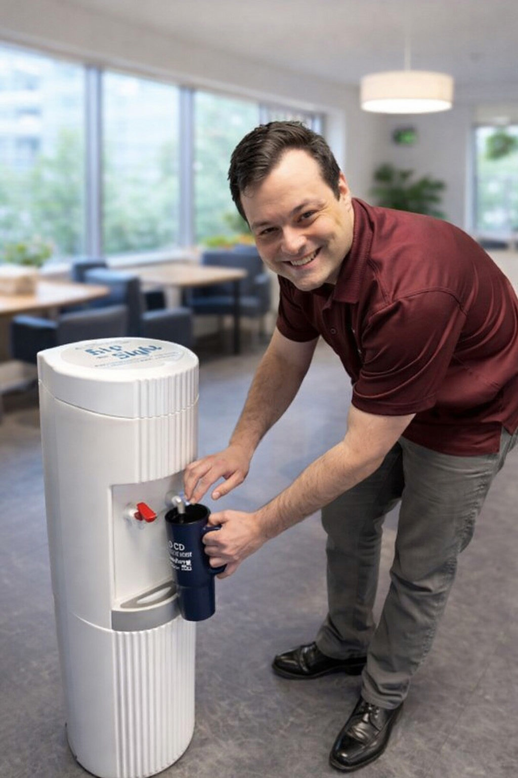 Steven Floyd filling up a cup at a watercooler