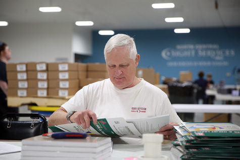 Employee pictured packing labels.